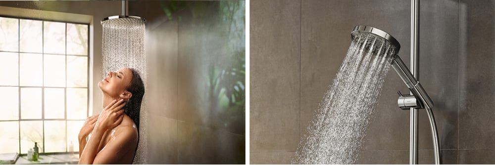 Woman standing under Raindance shower head, relaxed look on her face.