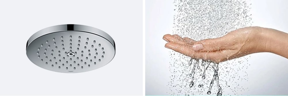Raindance 2GPM single function shower head. Hand catching spray droplets.