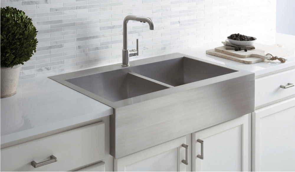 Stainless steel apron front sink, double basin.