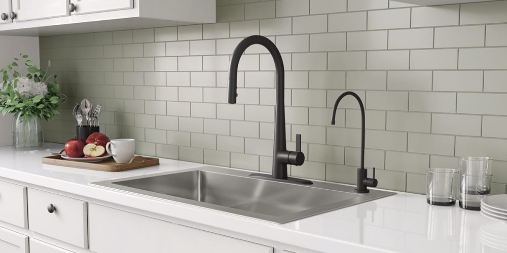 Stainless steel sink, Black kitchen faucet, water dispensing faucet.
