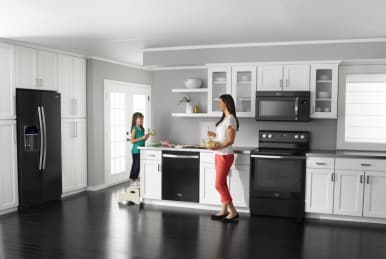 All white kitchen on sale with black appliances
