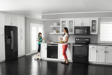 Kitchen with white cabinets deals and black appliances