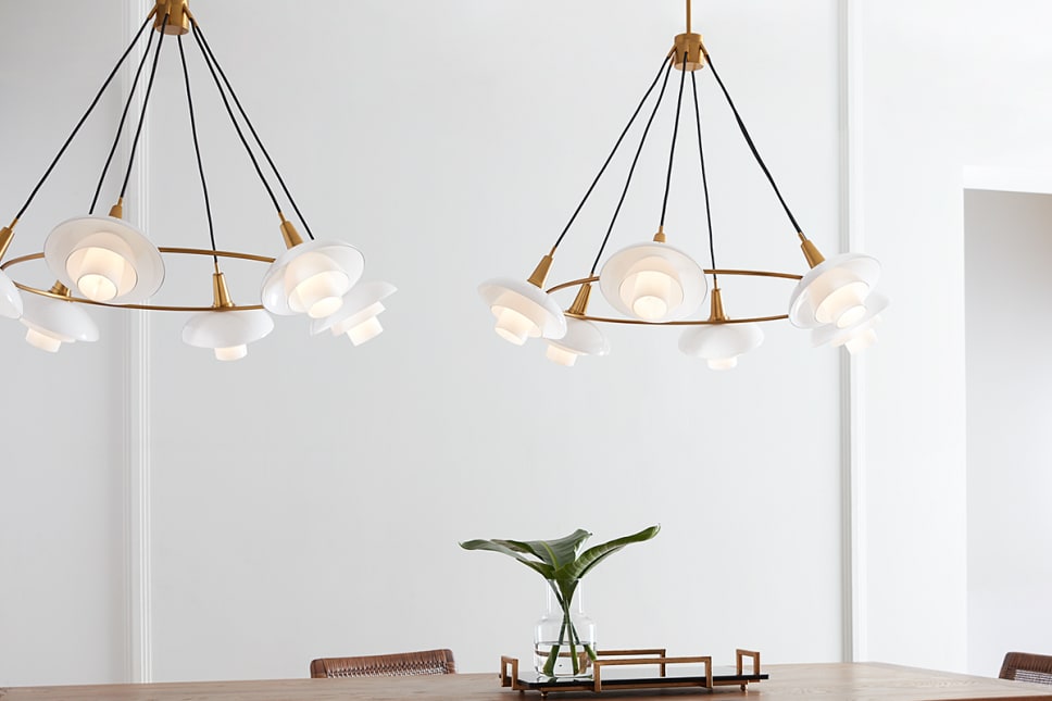 Rossi chandelier over dining table, milk glass shades, burnished gold