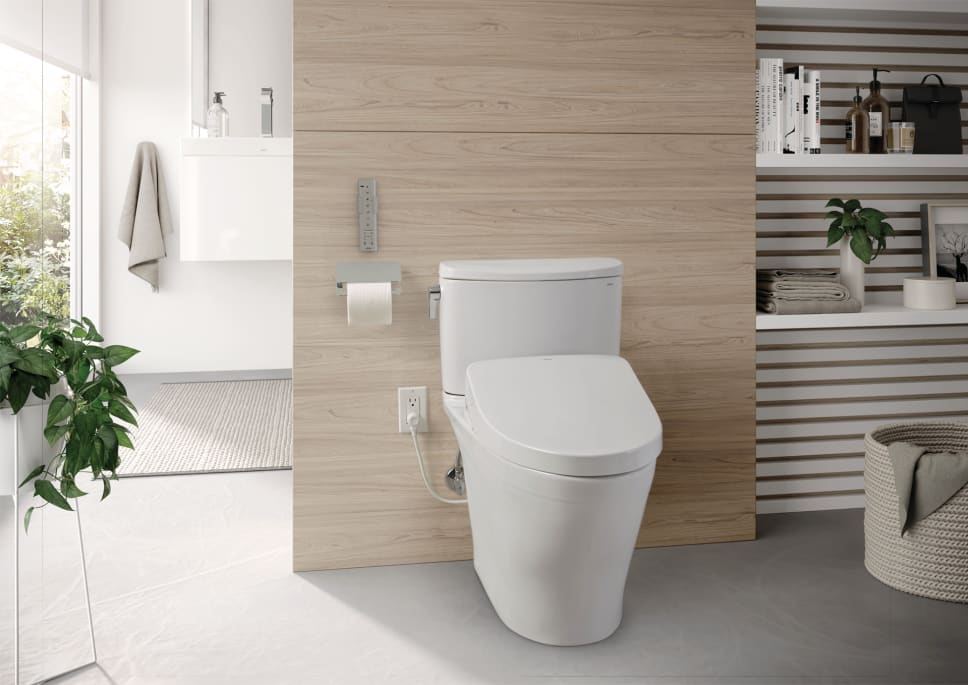 Toto bidet washlet with remote control. Modern airy bathroom.