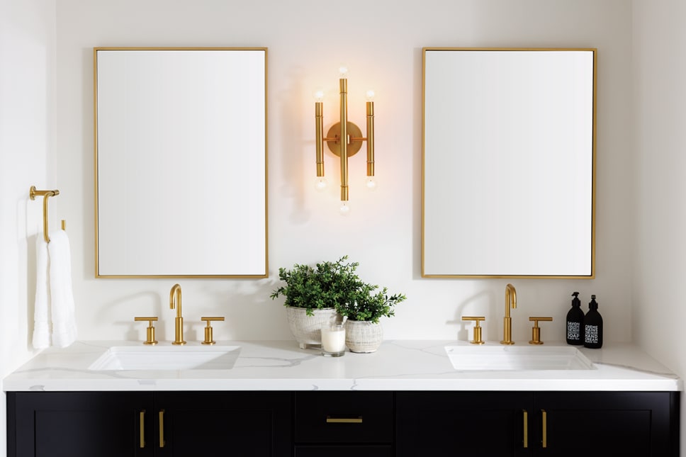 2 rectangular mirrors with gold frames, gold wall sconce, 2 gold faucets.