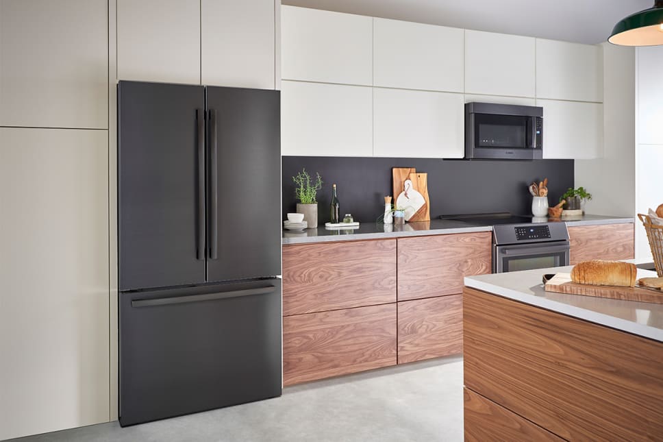 Black stainless french door refrigerator. Modern kitchen.