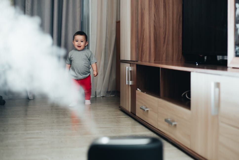 Toddler walking into room with humidifier turned on