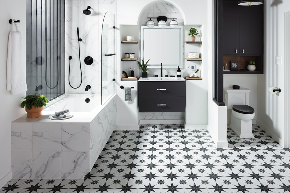 Black and white modern deco bath. Marble and star patterned tile.