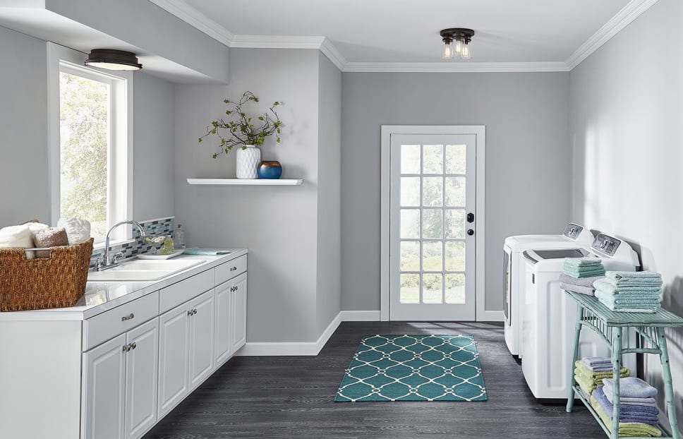A laundry room with two semi-flush ceiling fixtures.